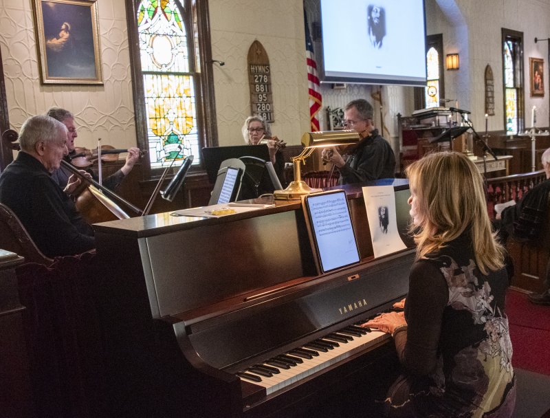 Organist Nancy Schaefer accompanies the Shrewsbury String Quartet.